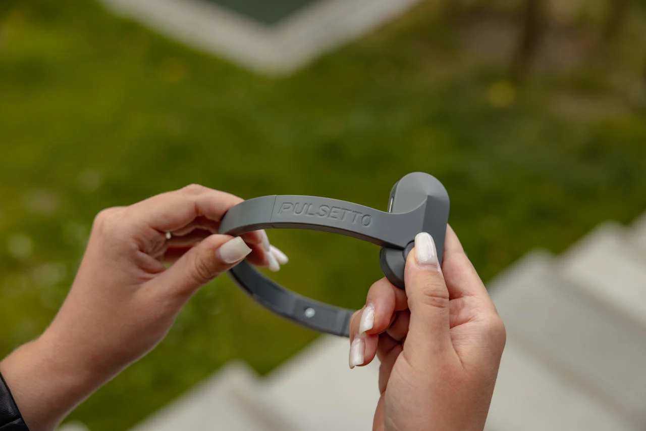 Pulsetto Lite Vagus Nerve Device — Held in Hand